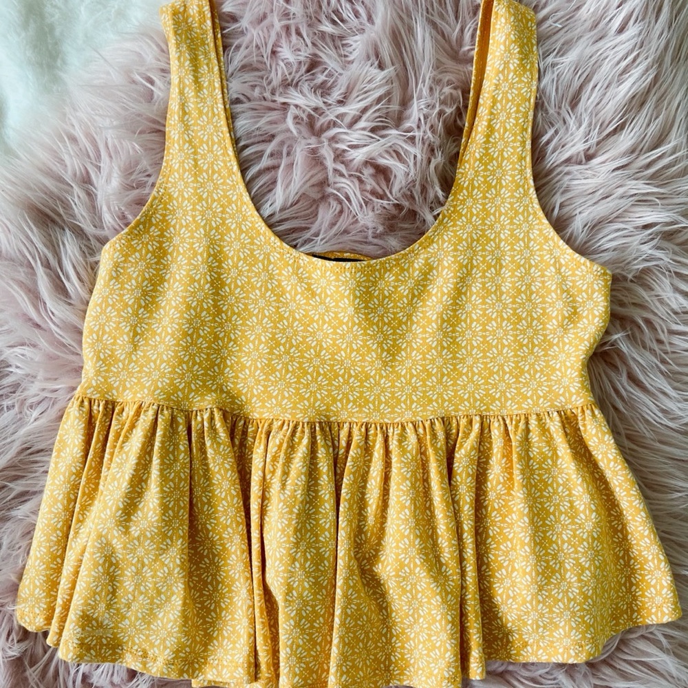 Yellow top with white designs
